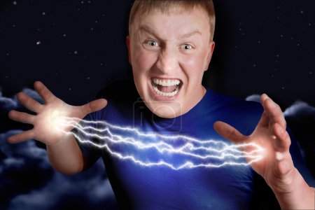 Aggressive man allows lightnings from hands in nightly sky, coll