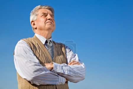 Senior man on background sky