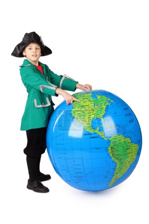Little boy in historical dress standing with big inflatable glob