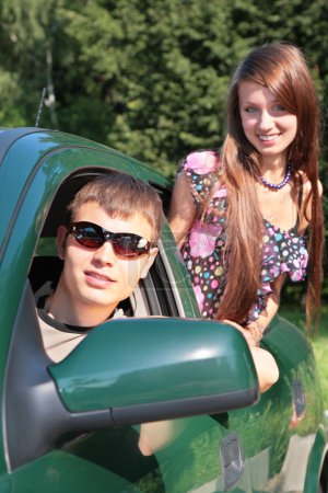 Gay and girl in car