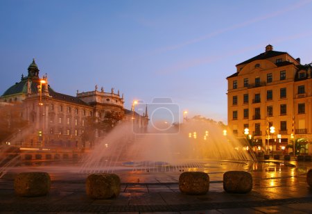 Fountain on square in evening