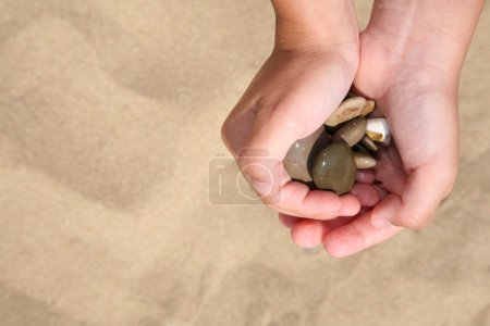 Stones in hands of the girl