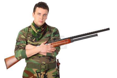 Man in camouflage with gun
