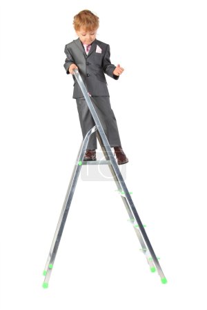 Boy in suit on step-ladder top