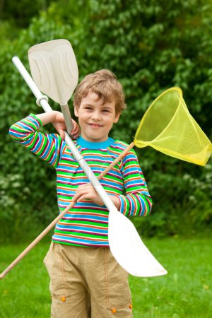 The boy with oars and a net outdoor