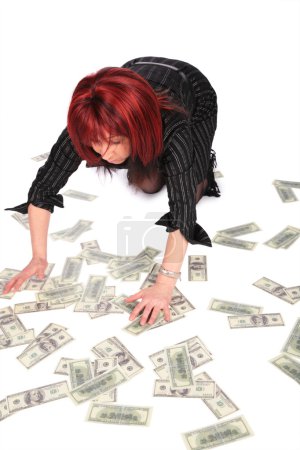 Woman gathering dollars