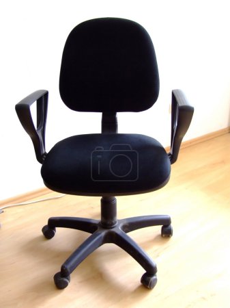 Black office chair on parquet