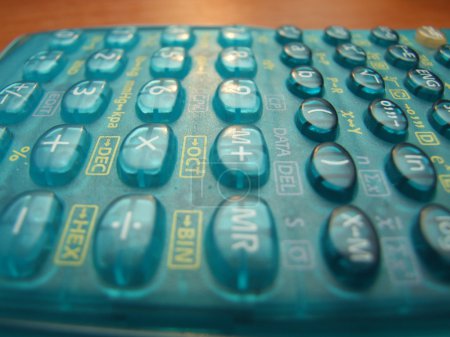 Scientific calculator on the brown table