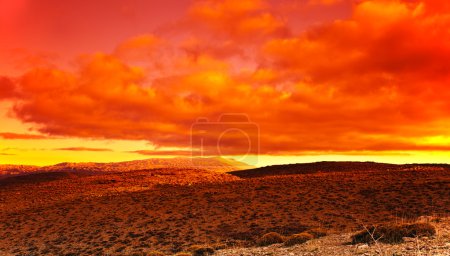 Dramatic red sunset at desert