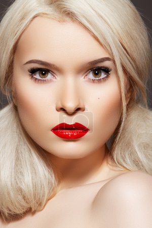 Doll style. Sensual woman model with fashion bright red lips make-up