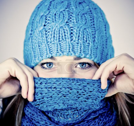 Beautiful girl with a scarf hiding