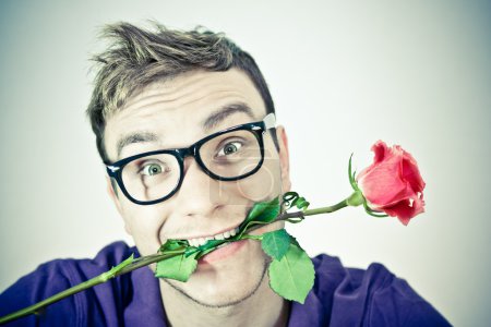 Crazy romantic man with a rose
