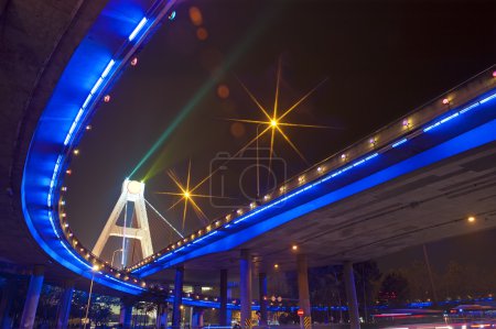 Bright lights under urban overpass
