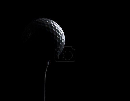 Silhouette of a golf ball on a tee, with copy space