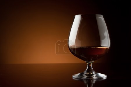 Glass of luxury cognac with copy space