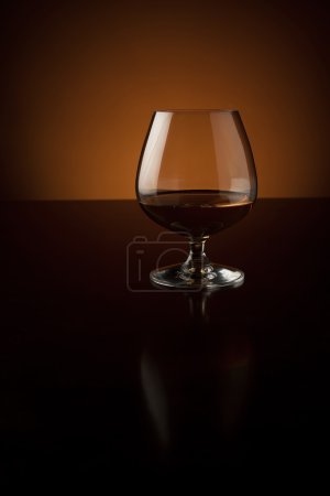 Glass of luxury cognac with copy space