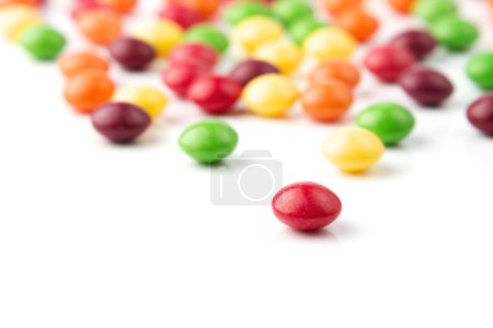 Colorful fruit candies on white background