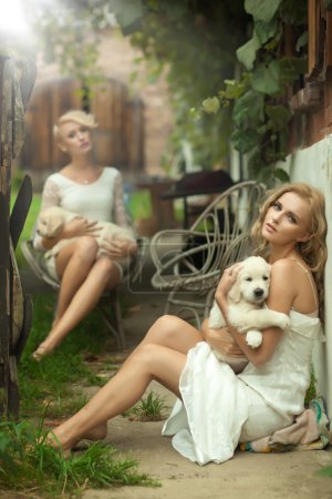 Two beauty ladies with cute puppies