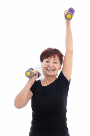Senior woman with barbells