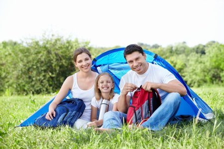 Family with a child in a tent