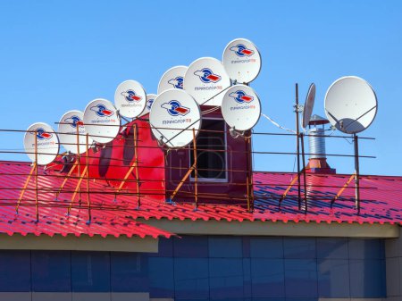 Gadijevo, Russia - May 13, 2018: Many satellite dishes are installed on the roof
