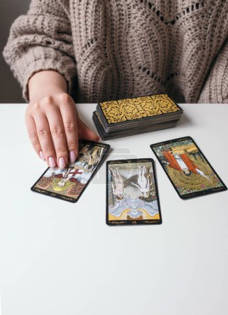 woman with tarot cards in hands