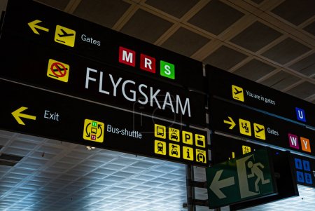Information panel with Flygskam word on it at an international airport.
