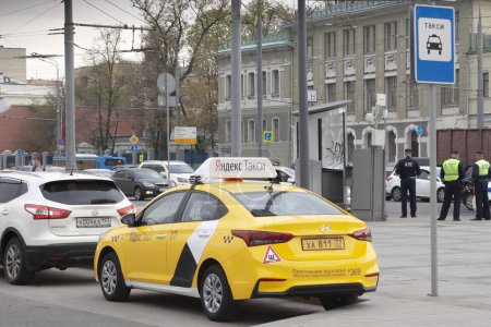 MOSCOW,RUSSIA-MAY 04 2018 :the Yandex taxi car on the city street. Service of the taxi is very widespread in Russia