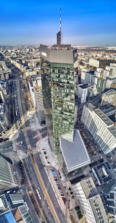 Beautiful panoramic aerial drone view to panorama of Warsaw modern City, Q22 - neomodern office skyscraper designed by APA Kurylowicz & Associates with collaboration from Buro Happold Polska
