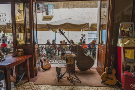 La Habana, Cuba - November 24th of 2017. Tourists in a cafe on Plaza Vieja Old Town square. 