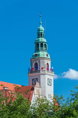 Olsztyn, Poland - May 1, 2018: Tower of new building of city hall with Polish and EU flags.