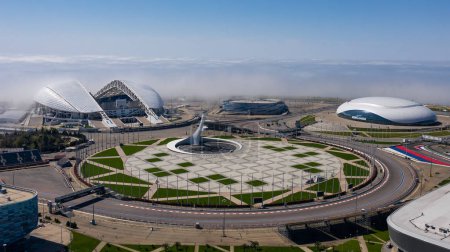 Sochi,Russia- 27 APR 2019 Early in the morning over the Olympic Park Sochi fell heavy fog from the black sea. Aerial photography with quadrocopter.The Fisht stadium, the Olympic flame into the clouds.