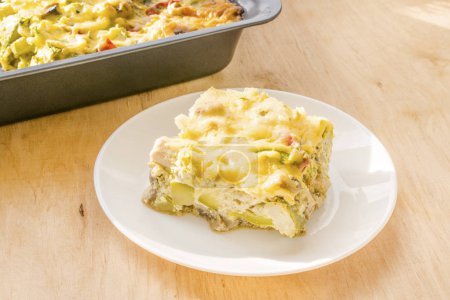 Zucchini casserole. Dietary, low-calorie fitness food. Home Casserole from courgettes with chicken and cheese, homemade food