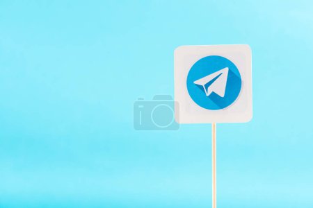 top view of telegram icon isolated on blue with copy space