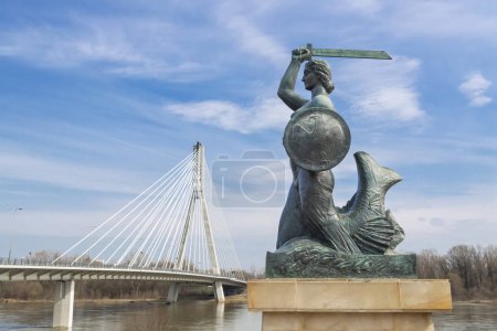 Capital of Poland - Warsaw. Symbol of Warsaw - Mermaid near suspension bridge.