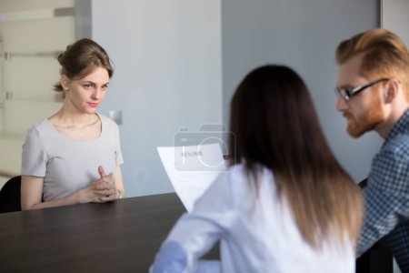 Worried female employee waiting during job interview