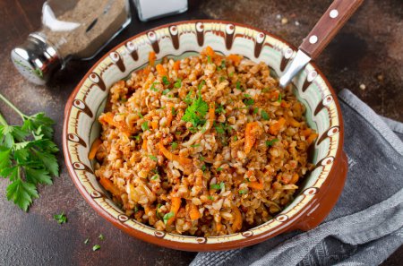 Buckwheat in a merchant manner (stewed with minced meat and vegetables). Russian traditional cuisine