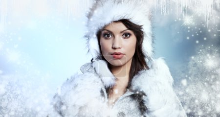 Portrait of winter woman with snow