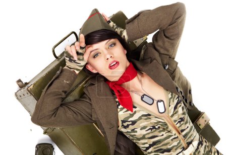 Pin-up image of sexy lovely brunet in military form