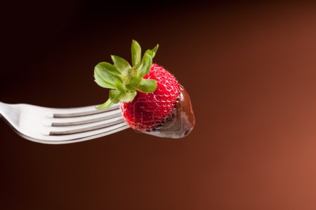 Fork with strawberry and chocolate