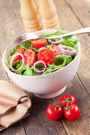 Arugula Salad with tomatoes and onion rings