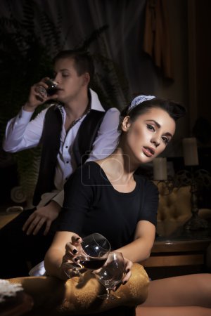 Sexy maid with glass of wine