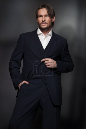 Handsome man wearing dark suit