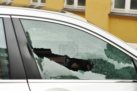 Broken passenger window, car theft