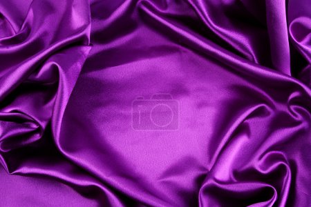 Closeup of folds in purple silk fabric