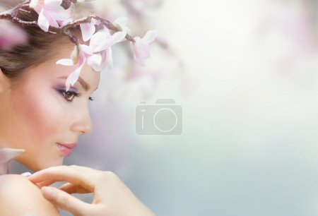 Beautiful Girl With Spring Flowers. Fresh Skin