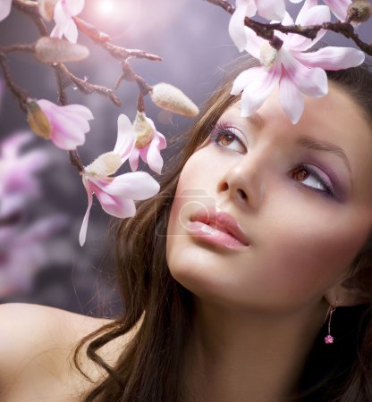 Beautiful Girl's face with flowers