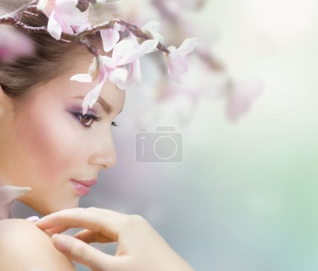 Beautiful Girl with Spring Flowers