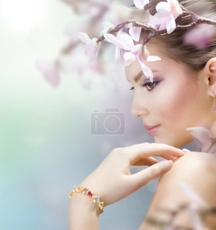 Beautiful Girl with Spring Flowers