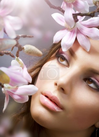 Beautiful Girl's face with flowers